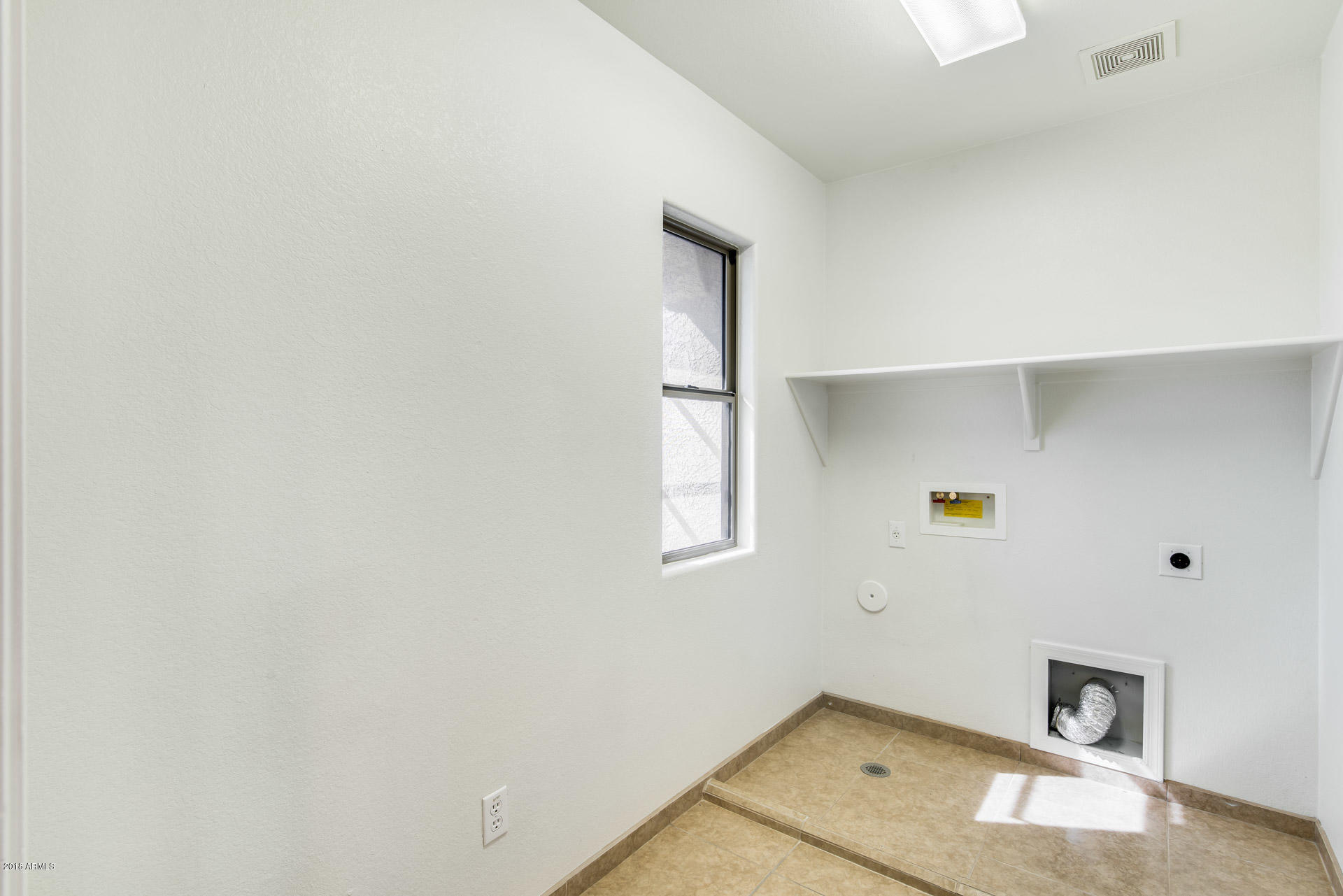 6320 West Beverly Road Laveen, AZ 85339 - Photo 23 of 30 a view of a storage & utility room with a window