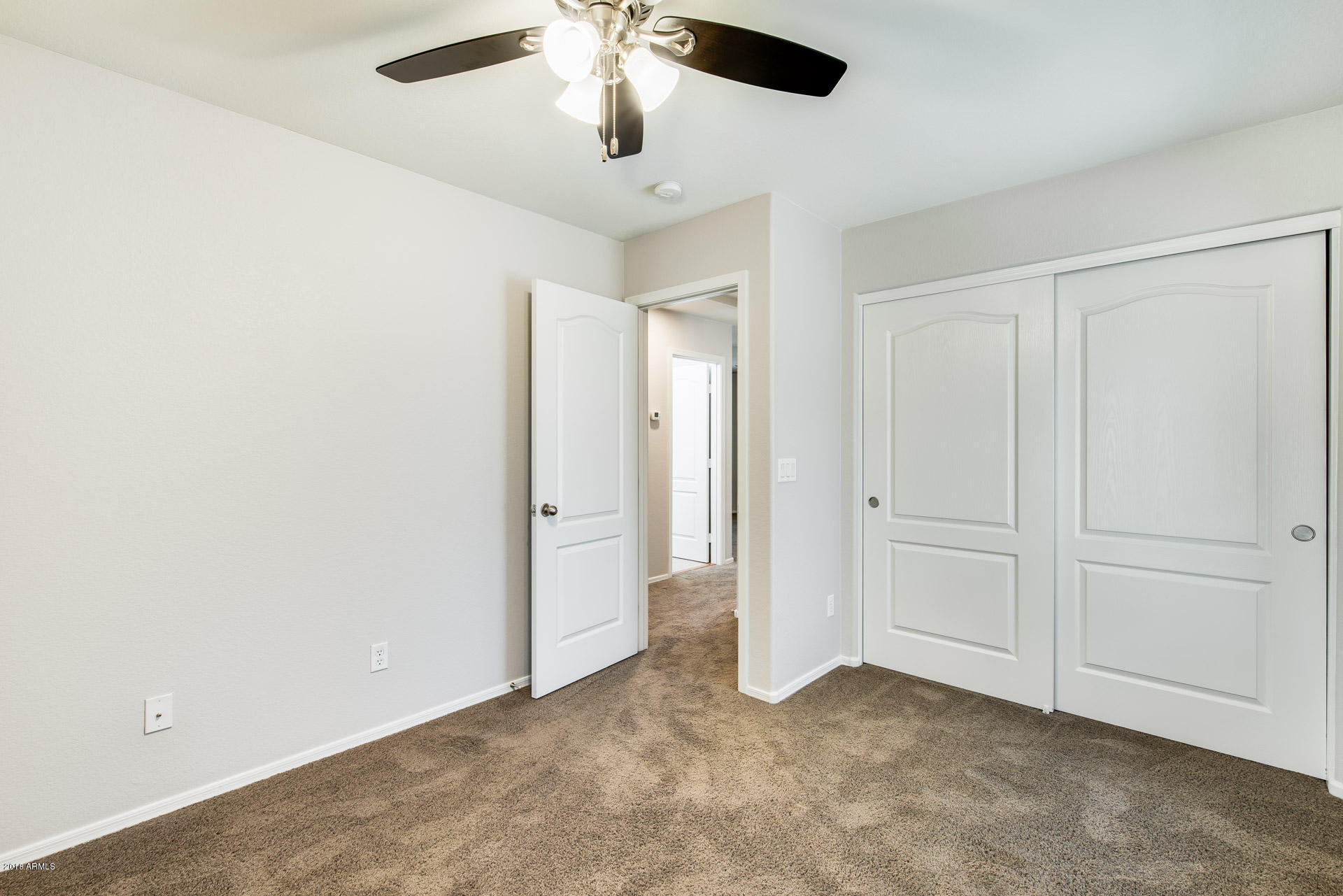 6320 West Beverly Road Laveen, AZ 85339 - Photo 28 of 30 an empty room with chandelier fan