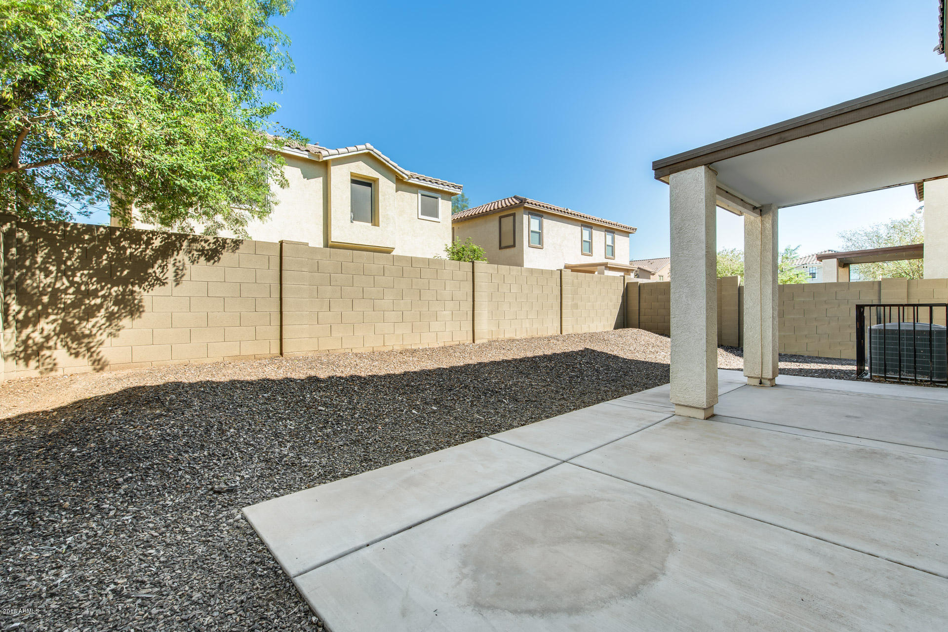 6320 West Beverly Road Laveen, AZ 85339 - Photo 30 of 30 a view of a white house with large windows
