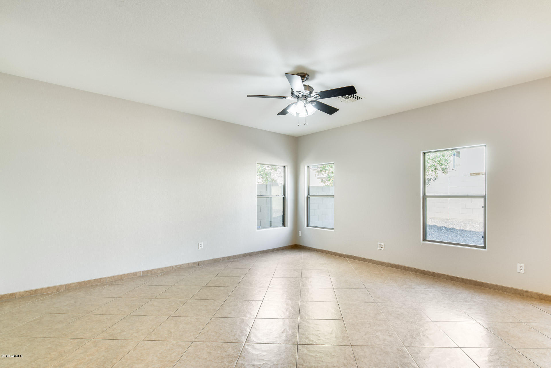 6320 West Beverly Road Laveen, AZ 85339 - Photo 3 of 30 a view of an empty room with a window