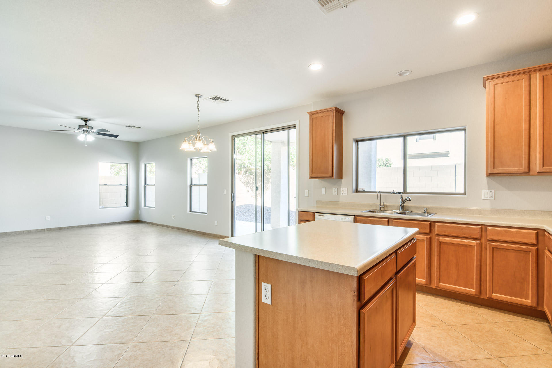 6320 West Beverly Road Laveen, AZ 85339 - Photo 4 of 30 a large kitchen with a sink and a large window