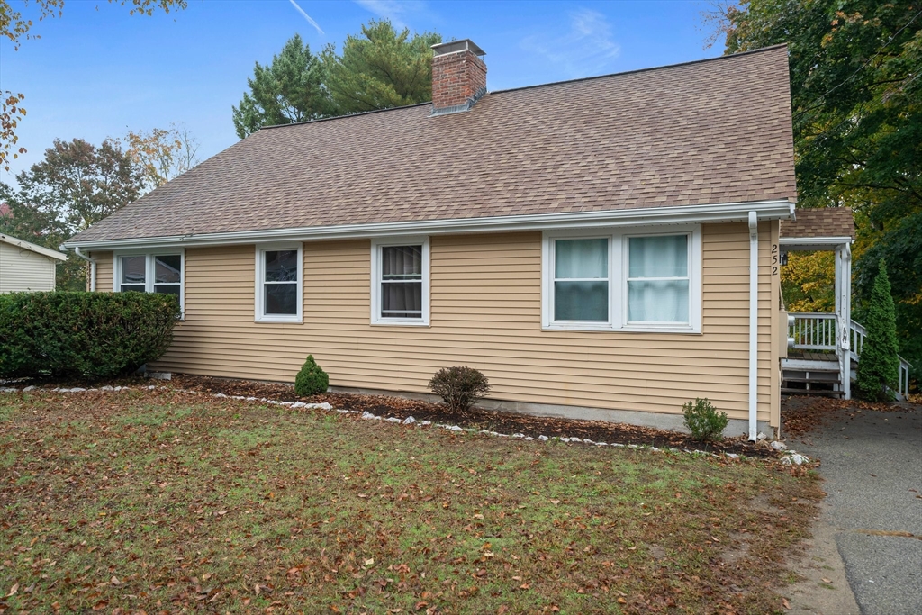 250-252 Mechanic Street Canton, MA 02021 - Photo 30 of 42 a front view of a house with garden