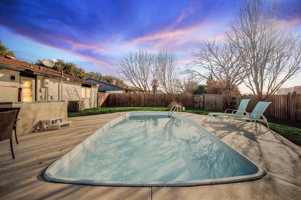 5112 Arbor Glen Road The Colony, TX 75056 - Photo 4 of 40 Pool at dusk with central AC unit