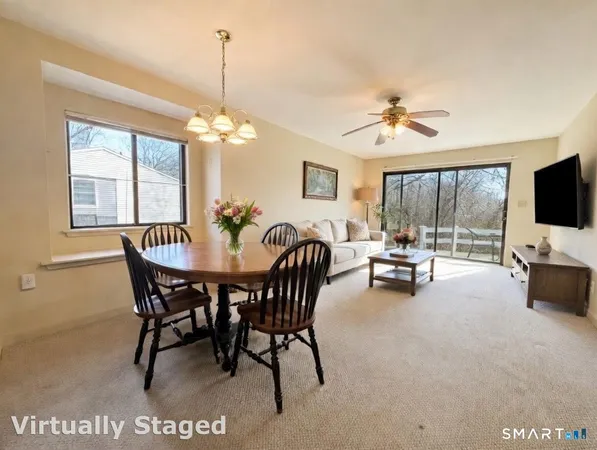 a view of a livingroom with furniture and a chandelier