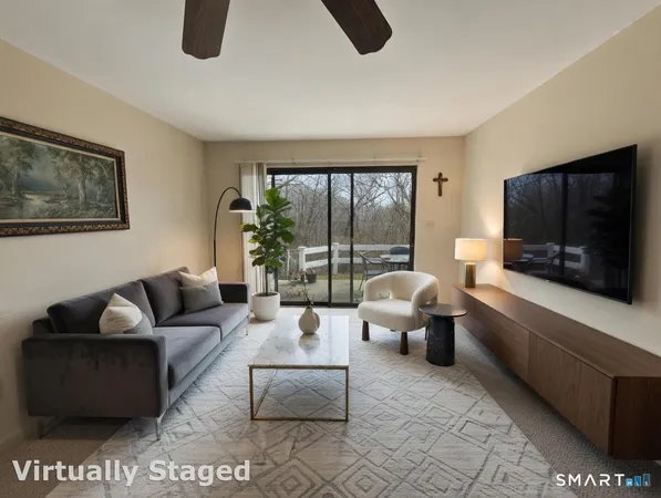 a view of a livingroom with furniture and a chandelier