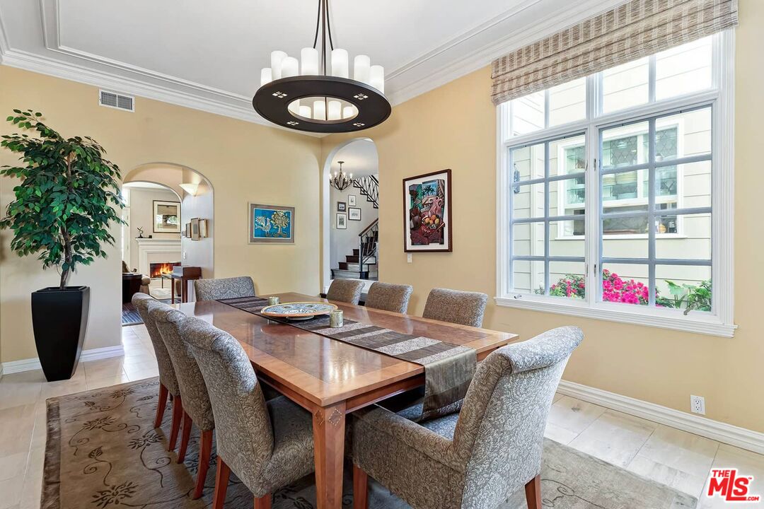 2286 Canyonback Road Los Angeles, CA 90049 - Photo 11 of 40 a view of a dining room with furniture window and wooden floor