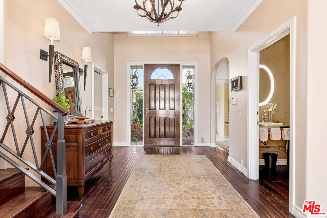 2286 Canyonback Road Los Angeles, CA 90049 - Photo 18 of 40 a view of a hallway with entryway wooden floor and livingroom view