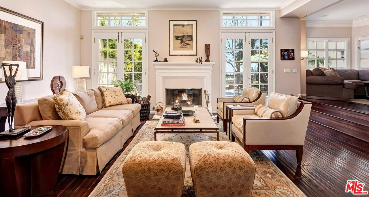 2286 Canyonback Road Los Angeles, CA 90049 - Photo 2 of 40 a living room with furniture a fireplace and a large window