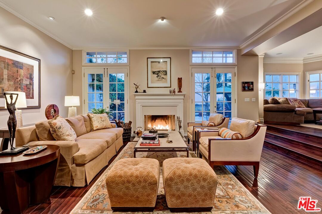 2286 Canyonback Road Los Angeles, CA 90049 - Photo 7 of 40 a living room with furniture and a fireplace