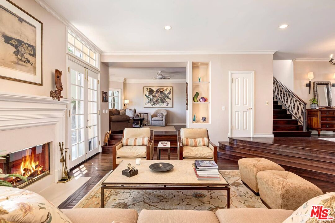 2286 Canyonback Road Los Angeles, CA 90049 - Photo 8 of 40 a living room with furniture fireplace and wooden floor