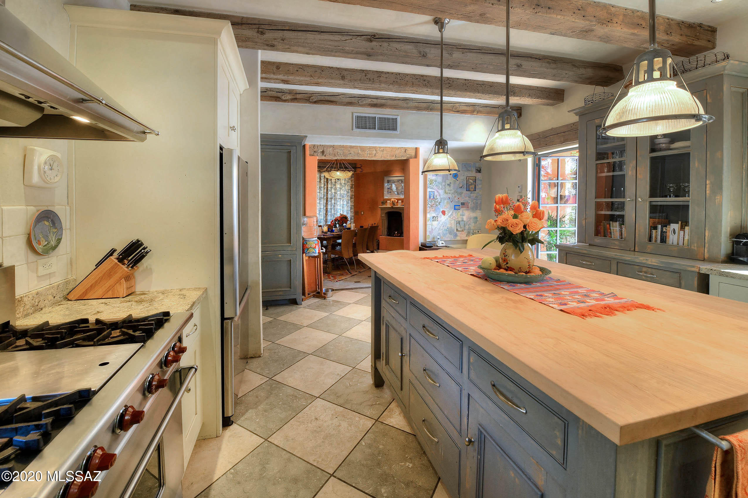 360 Harshaw Creek Road Patagonia, AZ 85624 - Photo 16 of 50 a kitchen with a stove a sink and a refrigerator