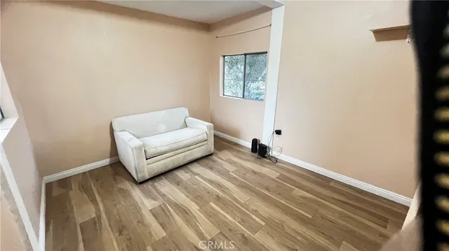 a living room with a couch and a window