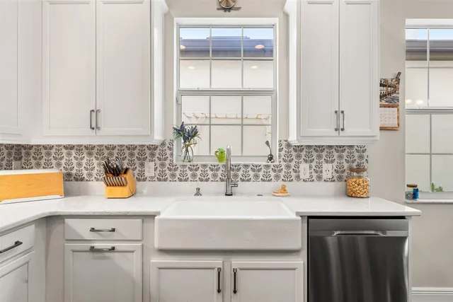 a kitchen with a sink and cabinets