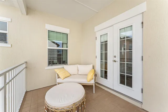 a white toilet sitting next to a window