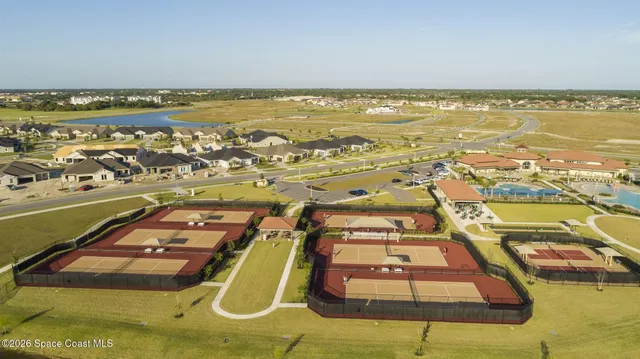 an aerial view of a house with a swimming pool