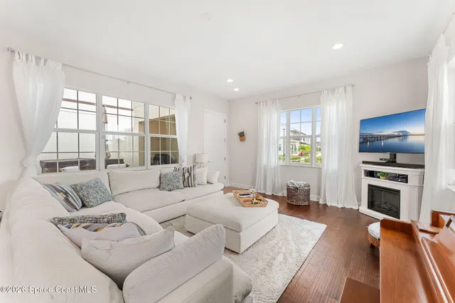 a large bedroom with a bed and a couch