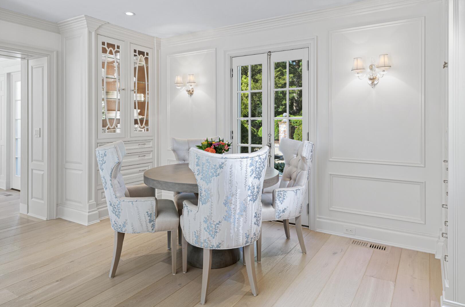 1024 Smith Ridge Road New Canaan, CT 06840 - Photo 16 of 40 a view of a dining room with furniture window and wooden floor