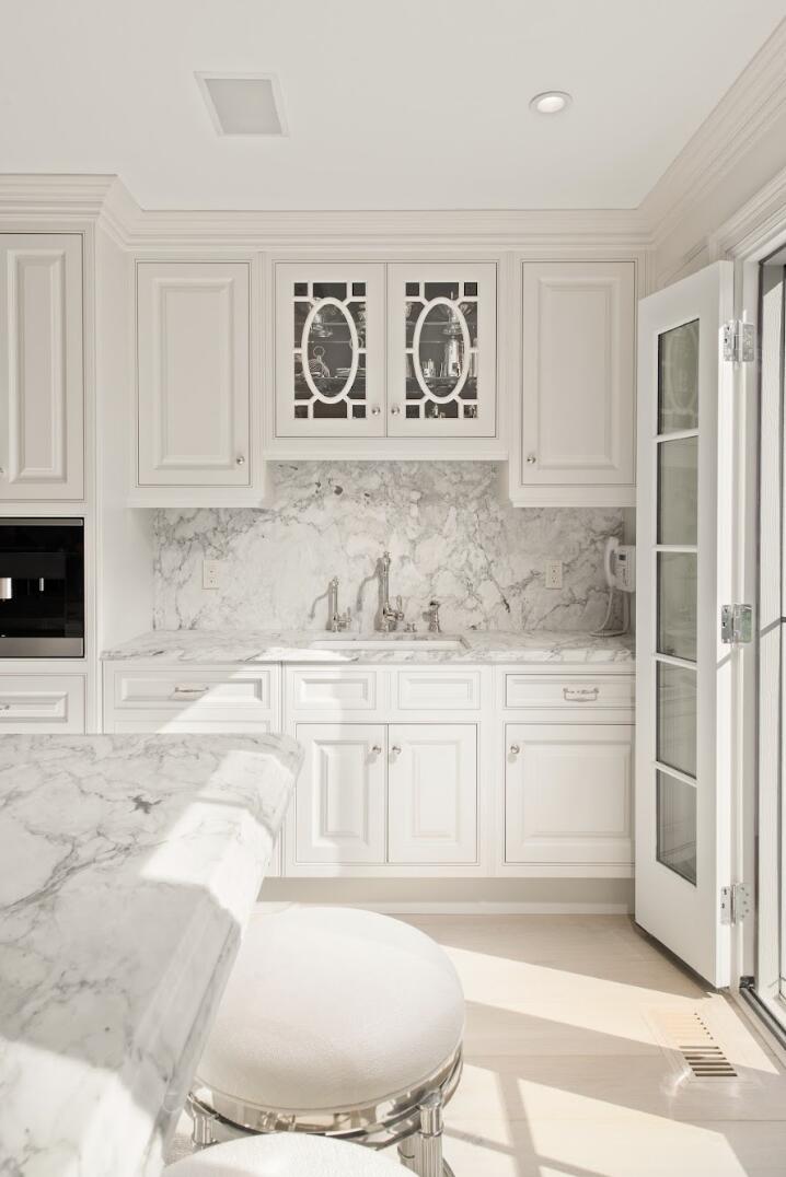 1024 Smith Ridge Road New Canaan, CT 06840 - Photo 18 of 40 a bathroom with granite countertop a tub and a sink