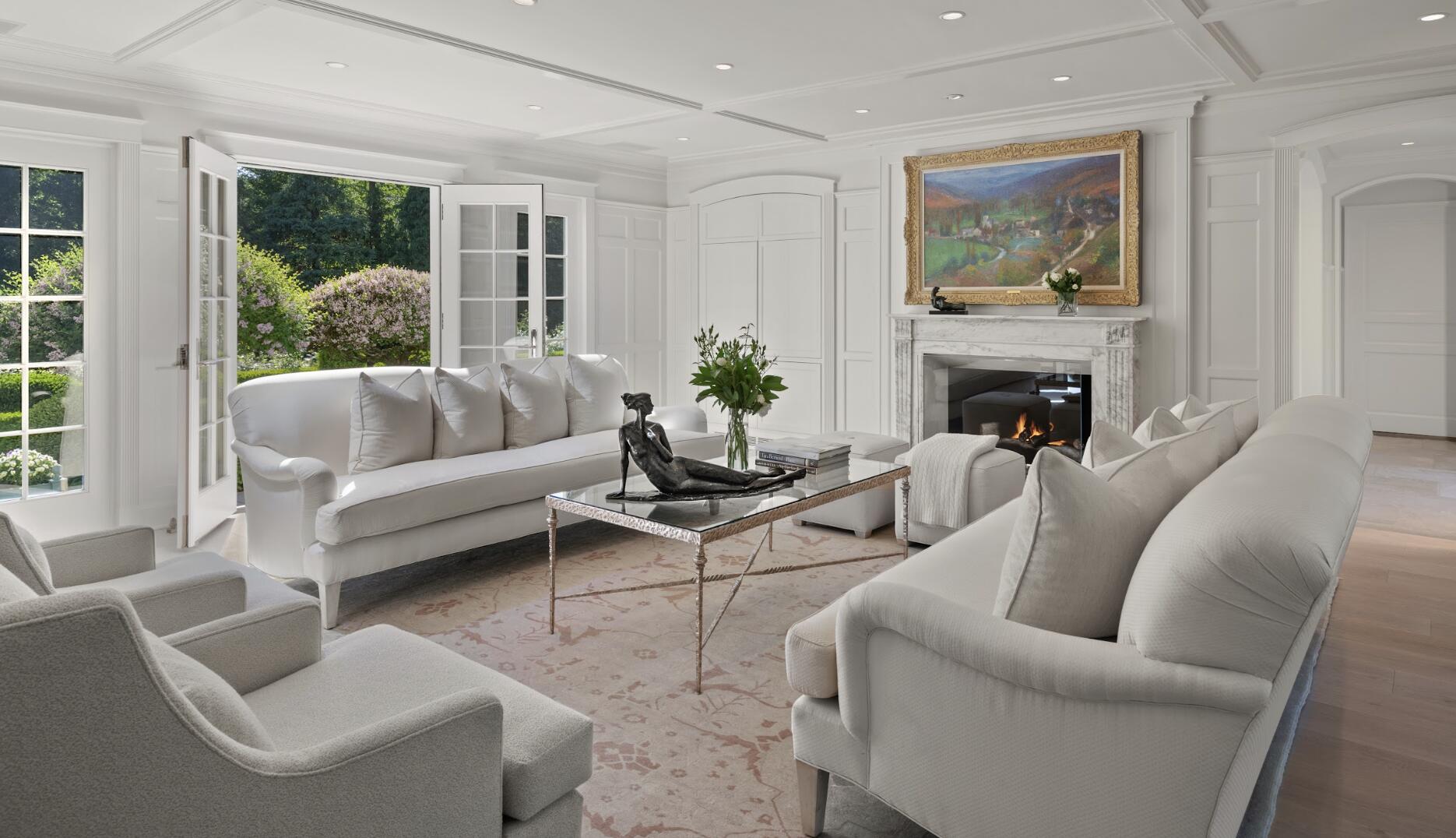 1024 Smith Ridge Road New Canaan, CT 06840 - Photo 19 of 40 a living room with furniture and a fireplace