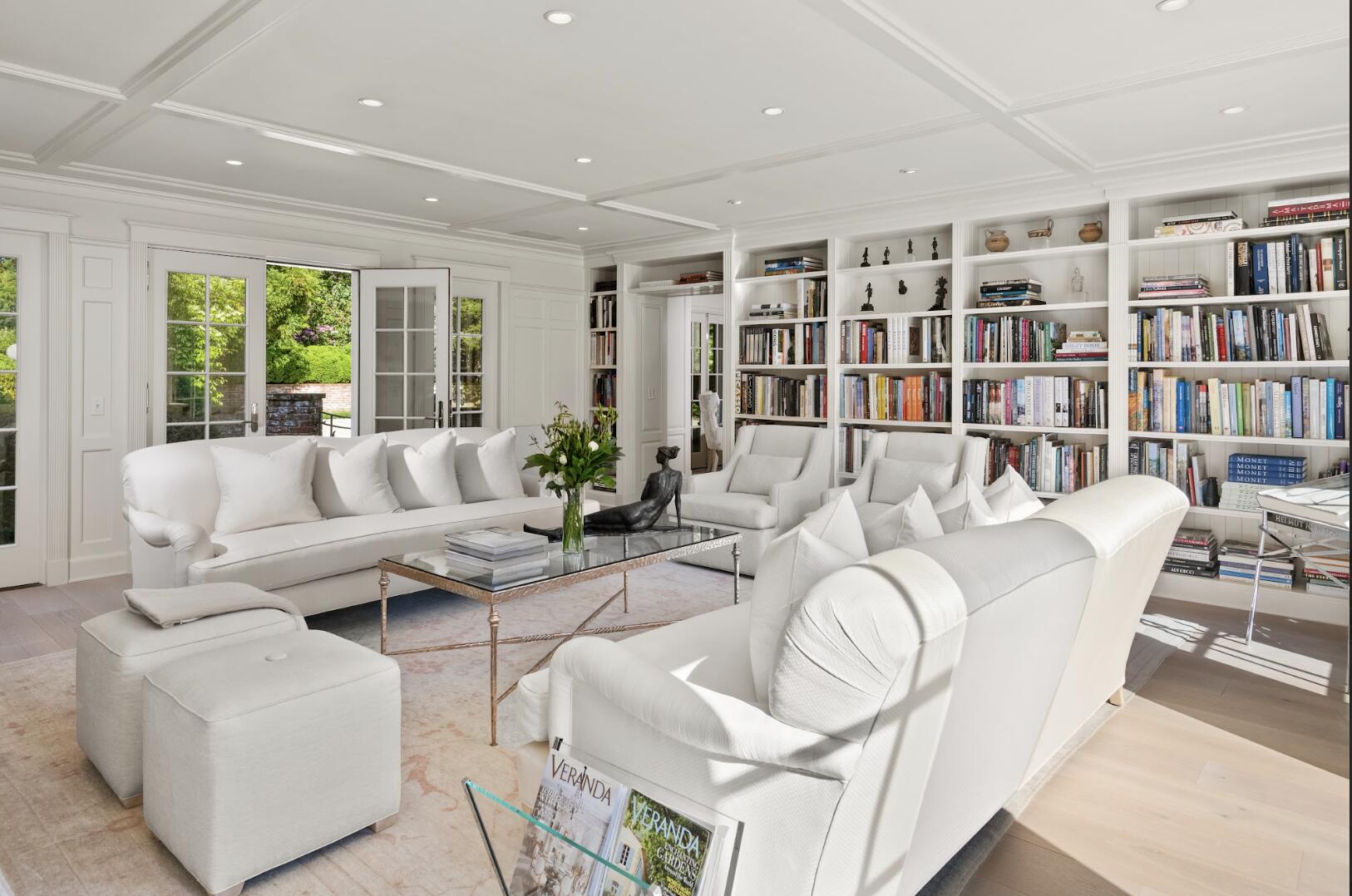 1024 Smith Ridge Road New Canaan, CT 06840 - Photo 20 of 40 a living room with furniture and a book shelf