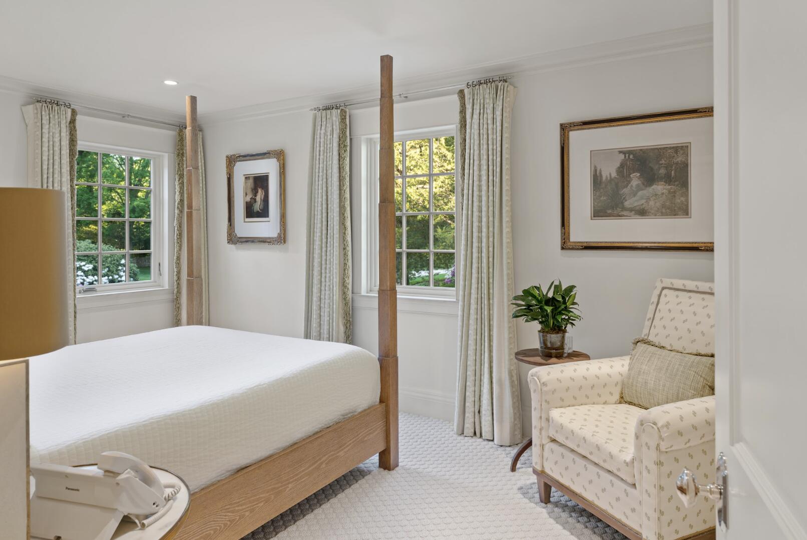 1024 Smith Ridge Road New Canaan, CT 06840 - Photo 28 of 40 a bedroom with a bed and a painting on the wall