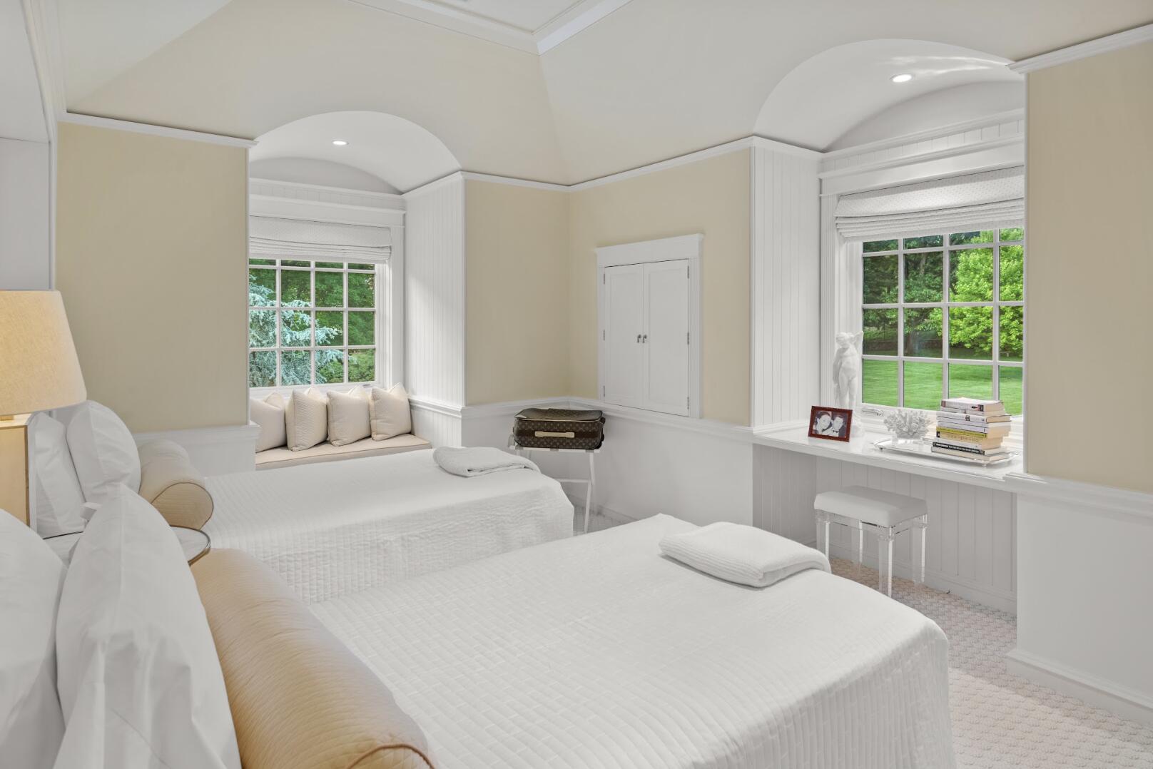 1024 Smith Ridge Road New Canaan, CT 06840 - Photo 29 of 40 a bedroom with two beds and a large window