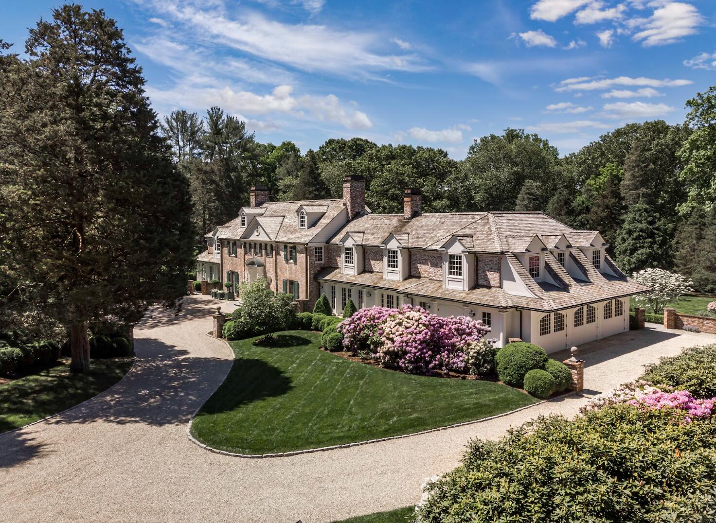 1024 Smith Ridge Road New Canaan, CT 06840 - Photo 37 of 40 a aerial view of a house with a yard and large trees