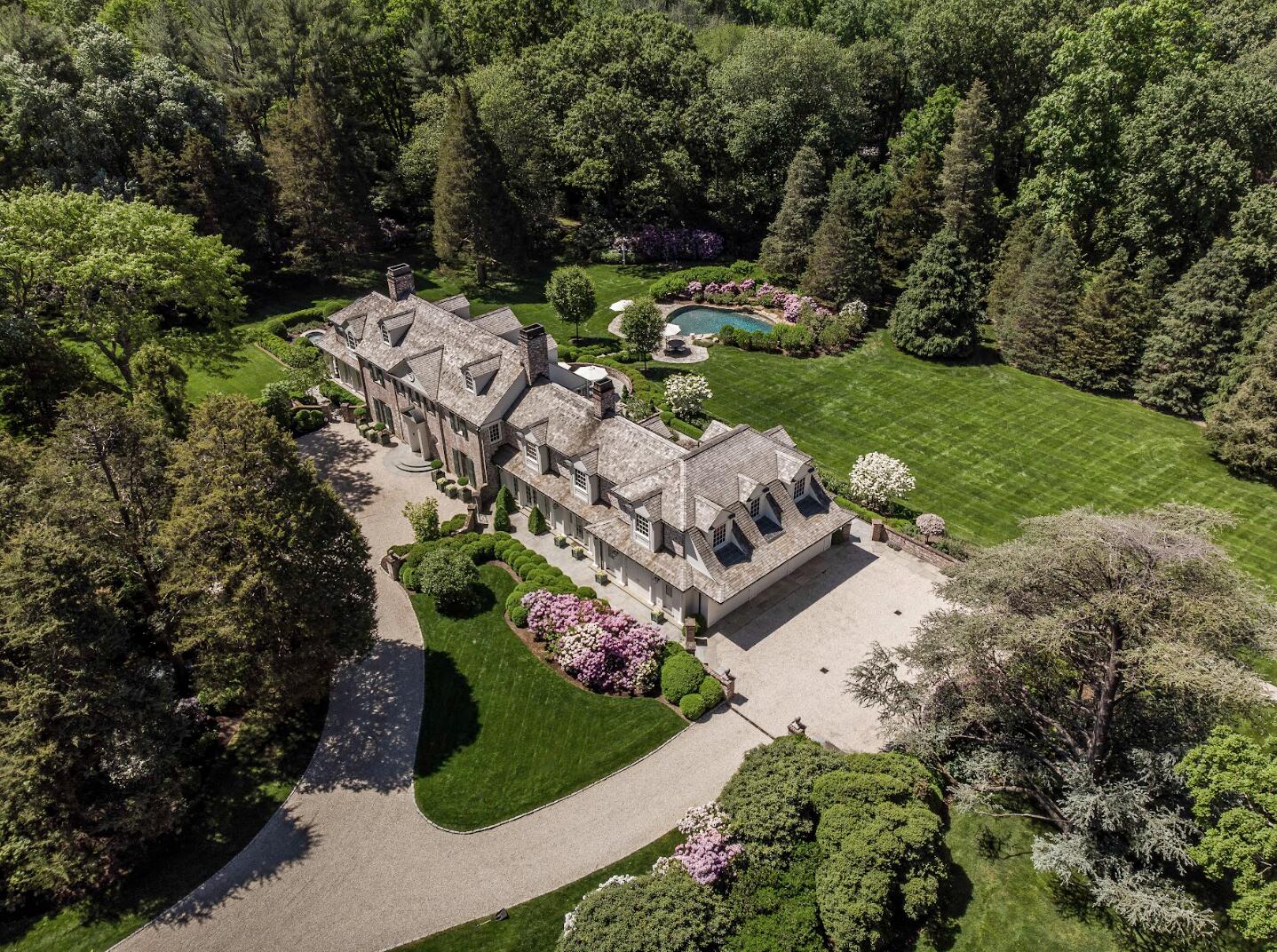 1024 Smith Ridge Road New Canaan, CT 06840 - Photo 38 of 40 an aerial view of a house with a yard and outdoor seating