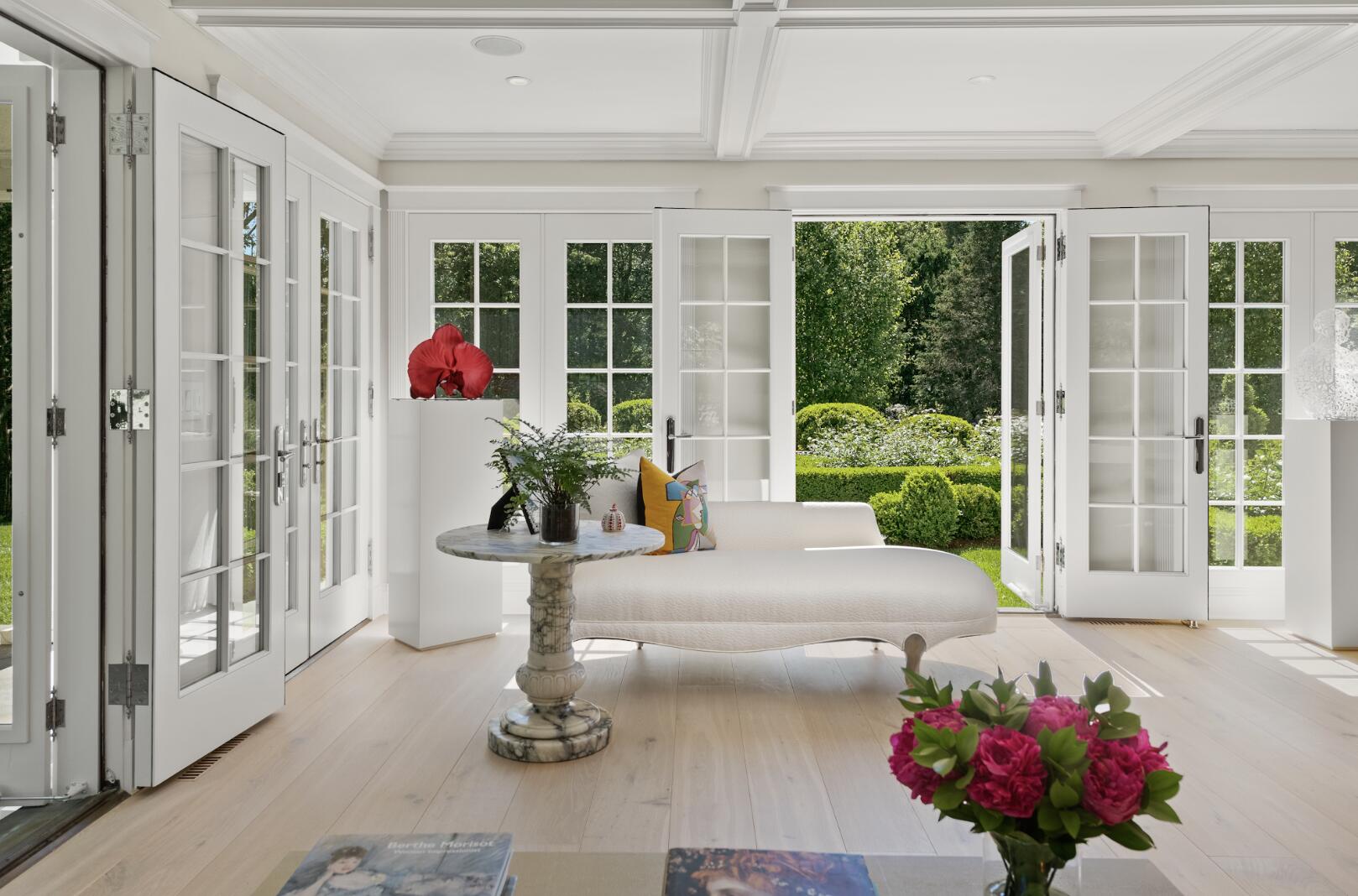 1024 Smith Ridge Road New Canaan, CT 06840 - Photo 10 of 40 a living room with furniture and flowers