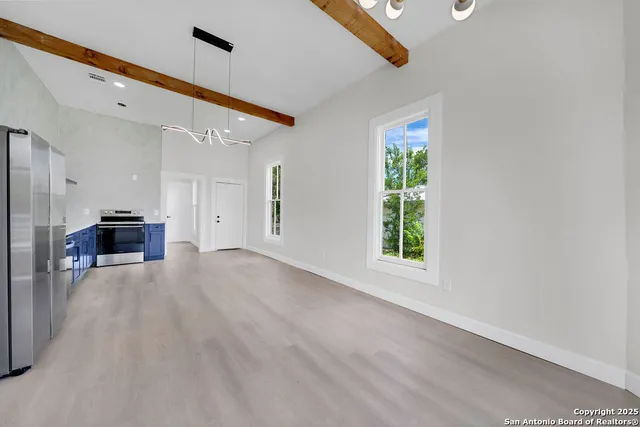a view of livingroom with furniture and windows