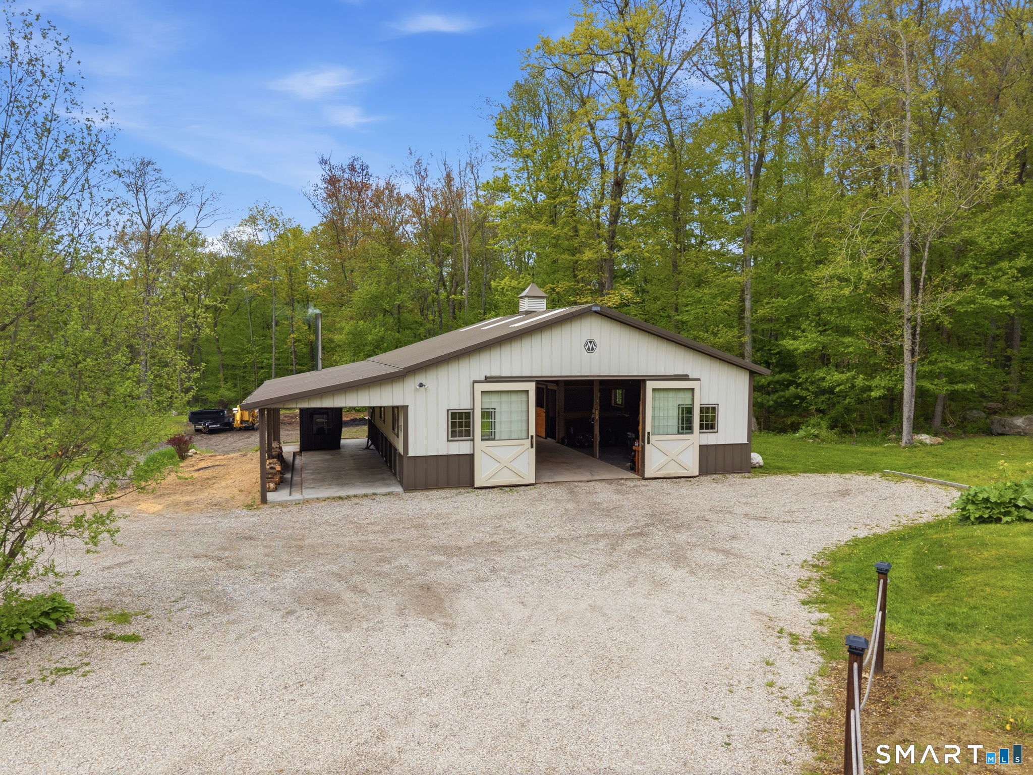 287 South Bear Hill Road Chaplin, CT 06235 - Photo 31 of 37 a front view of a house with a yard and garage