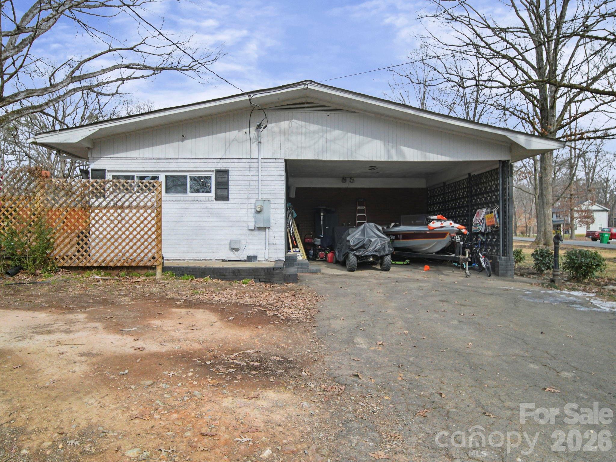 201 North Beverly Drive Locust, NC 28097 - Photo 12 of 36 a view of a car parked front of garage