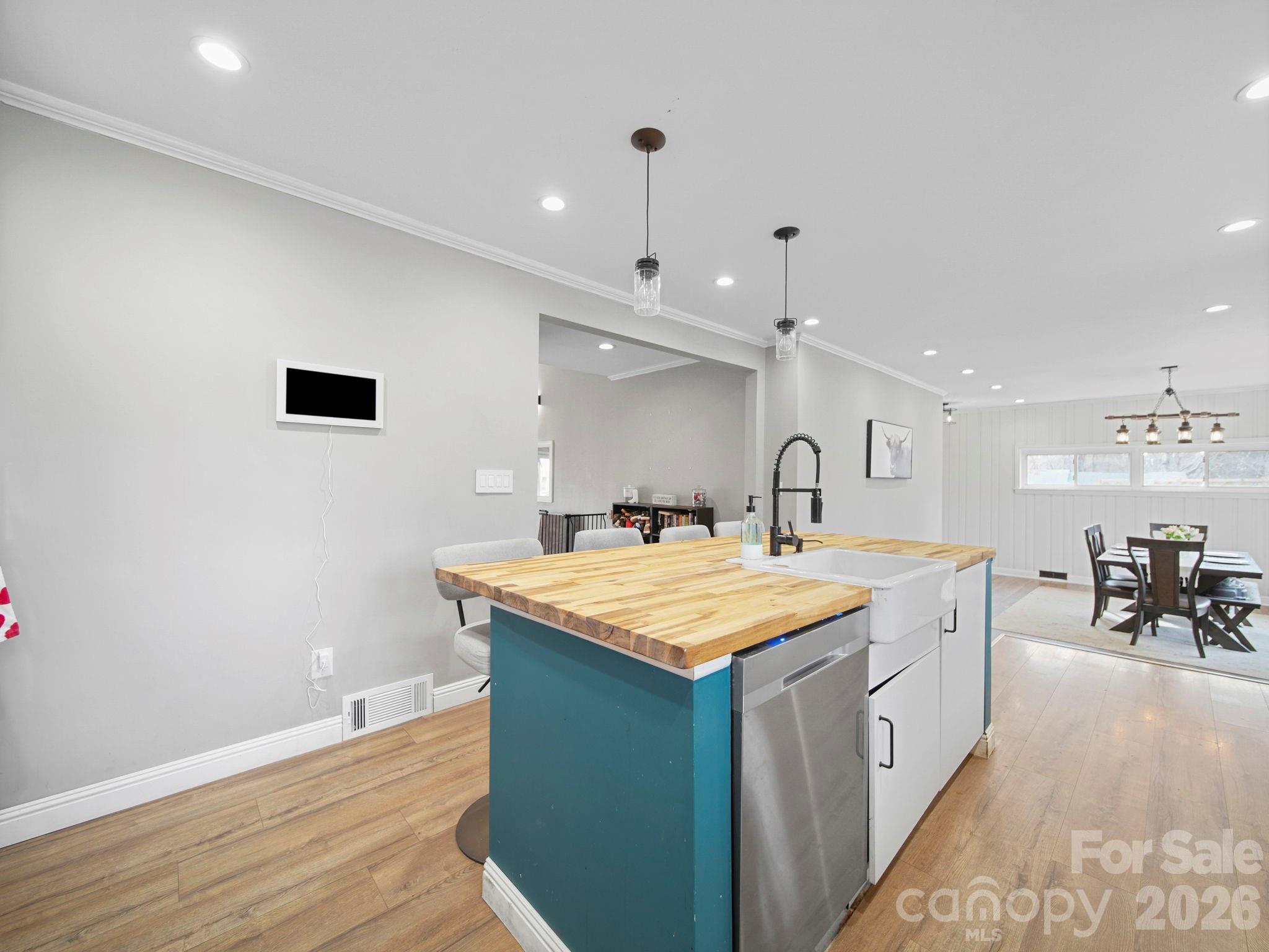 201 North Beverly Drive Locust, NC 28097 - Photo 18 of 36 a large white kitchen with wooden floor