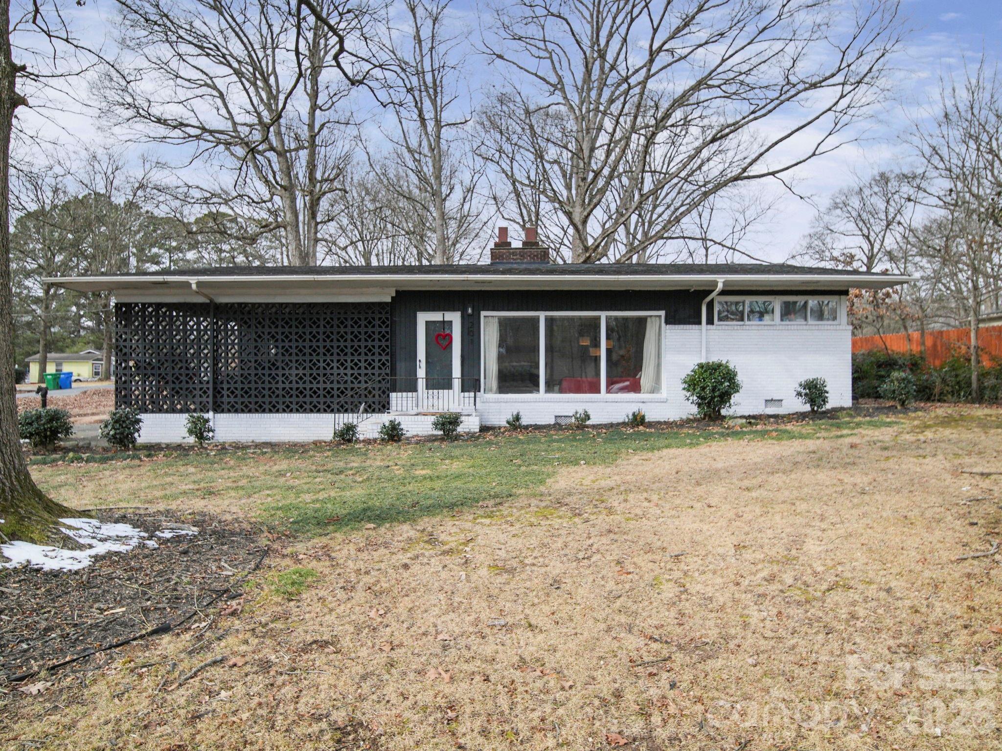 201 North Beverly Drive Locust, NC 28097 - Photo 2 of 36 a view of a house with backyard and trees