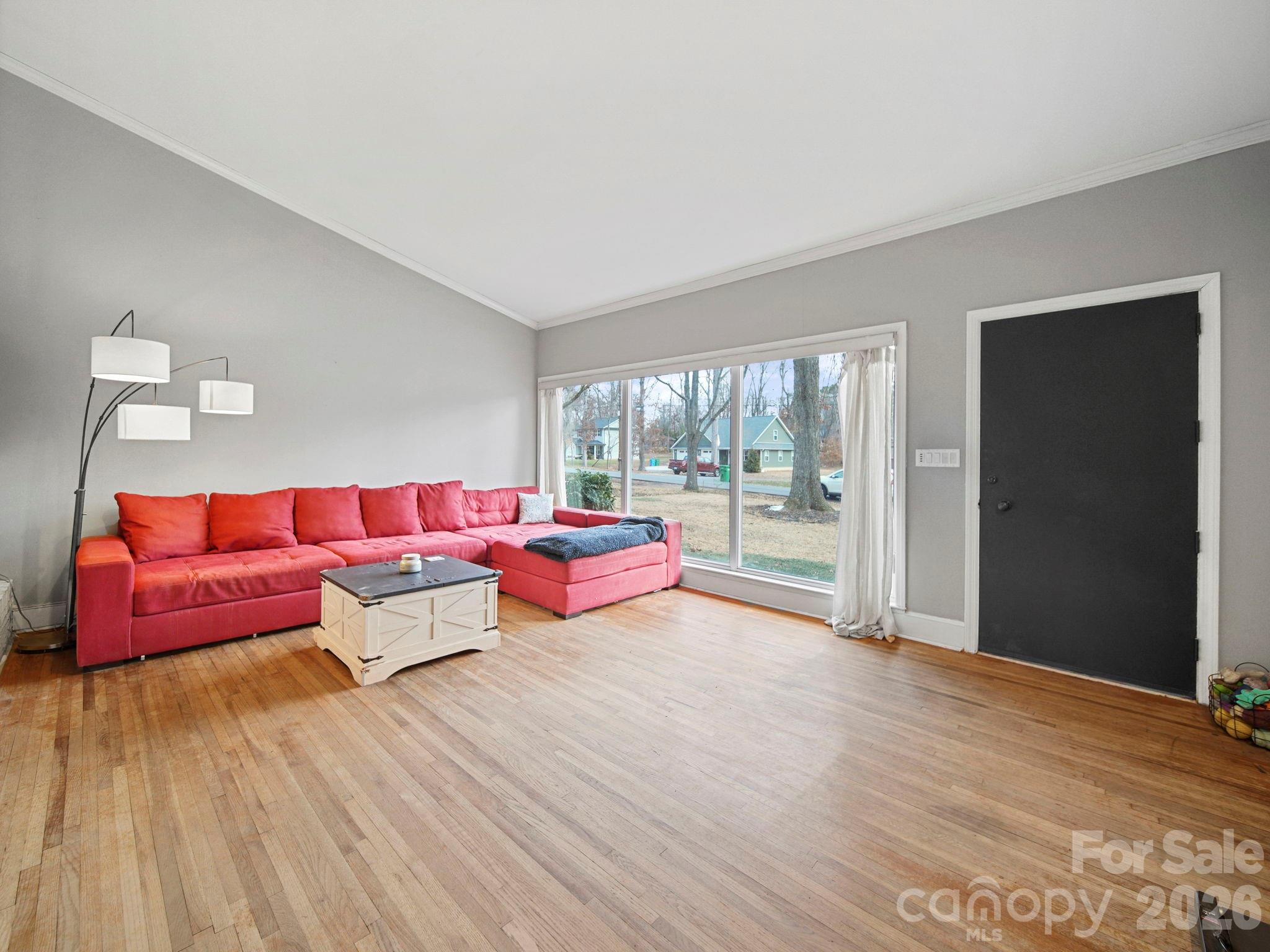201 North Beverly Drive Locust, NC 28097 - Photo 21 of 36 a living room with furniture and wooden floor