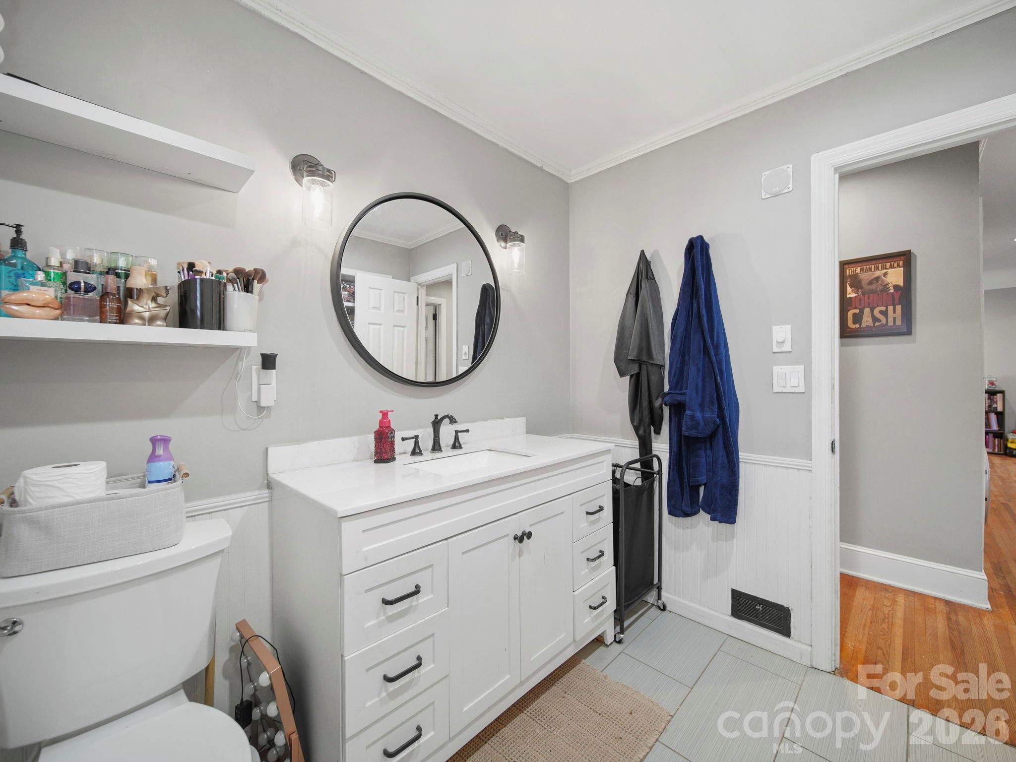 201 North Beverly Drive Locust, NC 28097 - Photo 28 of 36 a bathroom with a toilet sink and vanity
