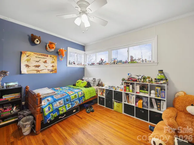 a bed room with a bed and a bookshelf