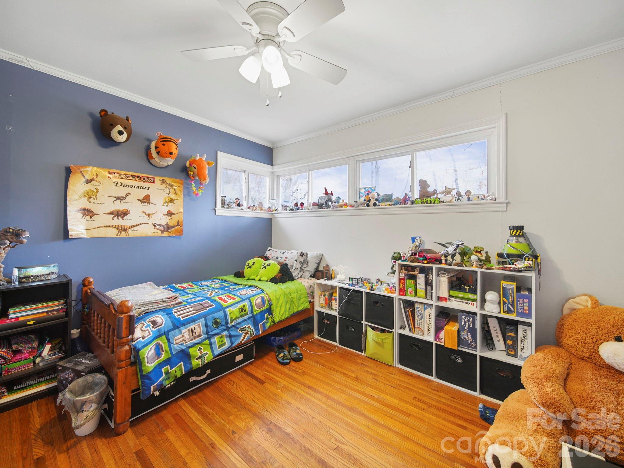 201 North Beverly Drive Locust, NC 28097 - Photo 29 of 36 a bed room with a bed and a bookshelf