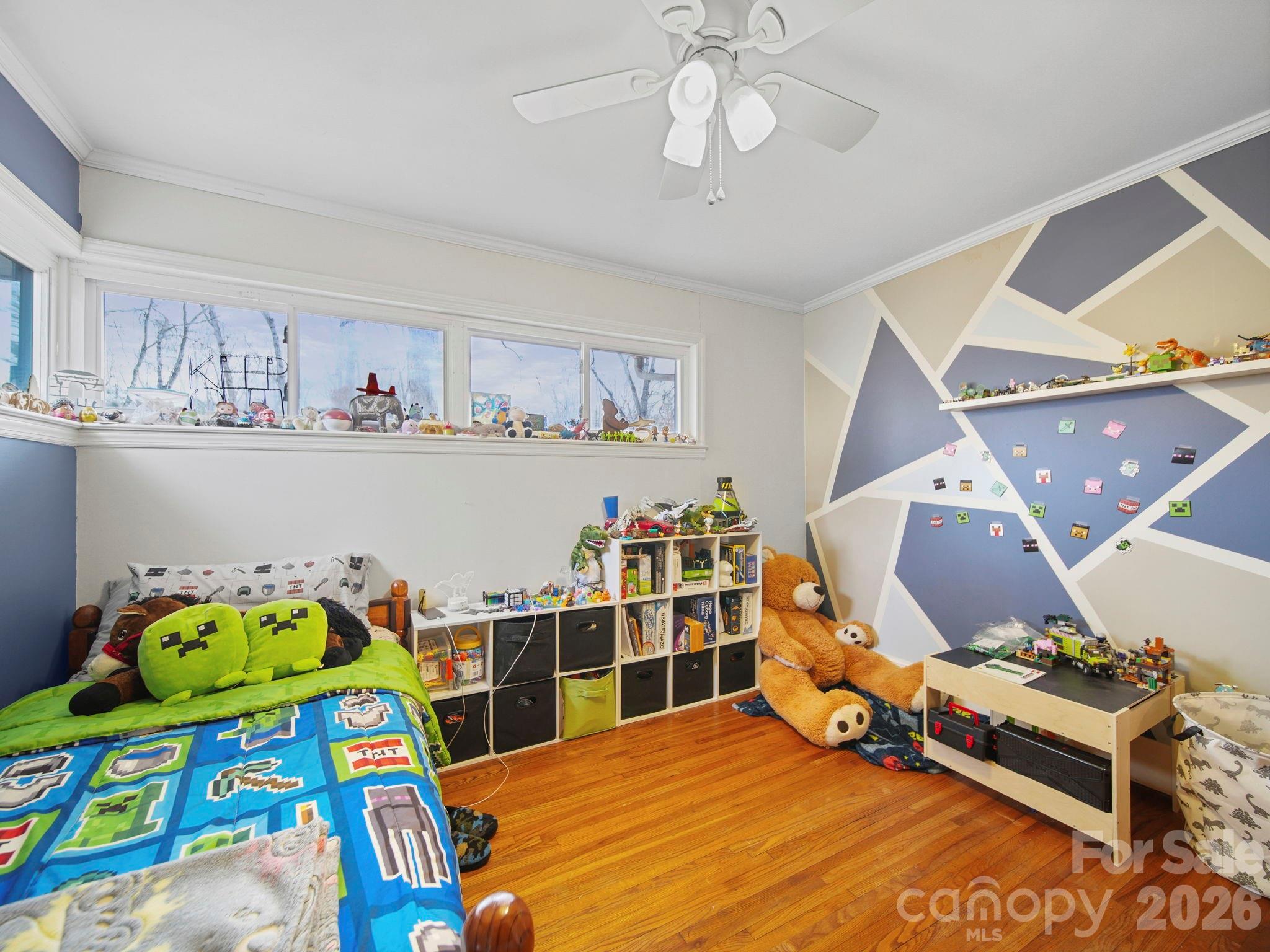 201 North Beverly Drive Locust, NC 28097 - Photo 30 of 36 a bedroom with a bed and wooden floor