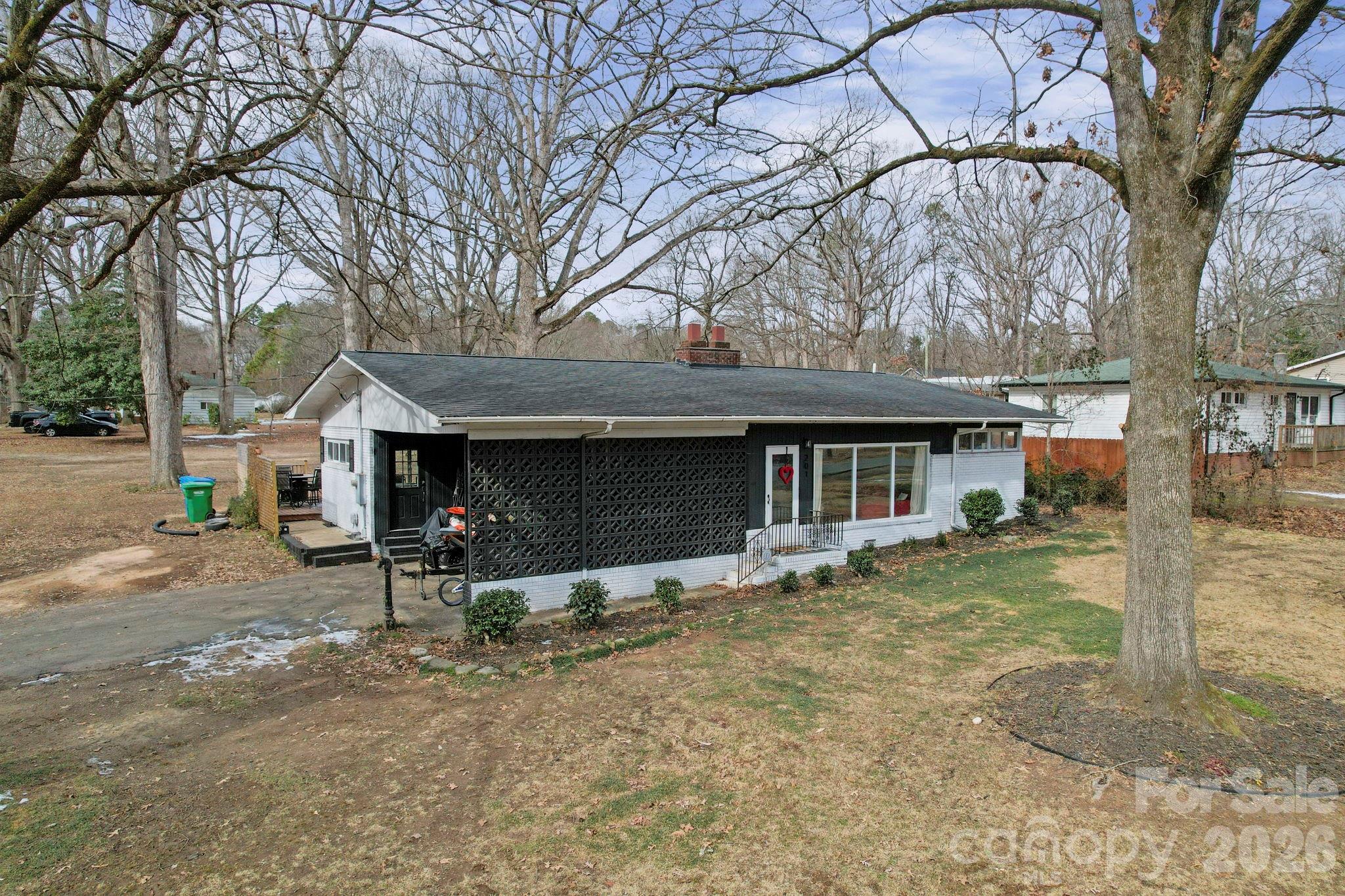 201 North Beverly Drive Locust, NC 28097 - Photo 4 of 36 a view of a house with a yard and large tree