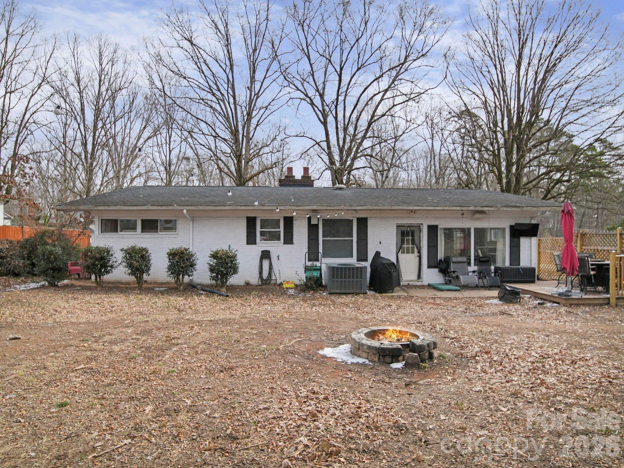 201 North Beverly Drive Locust, NC 28097 - Photo 7 of 36 a front view of a house with a yard and seating space