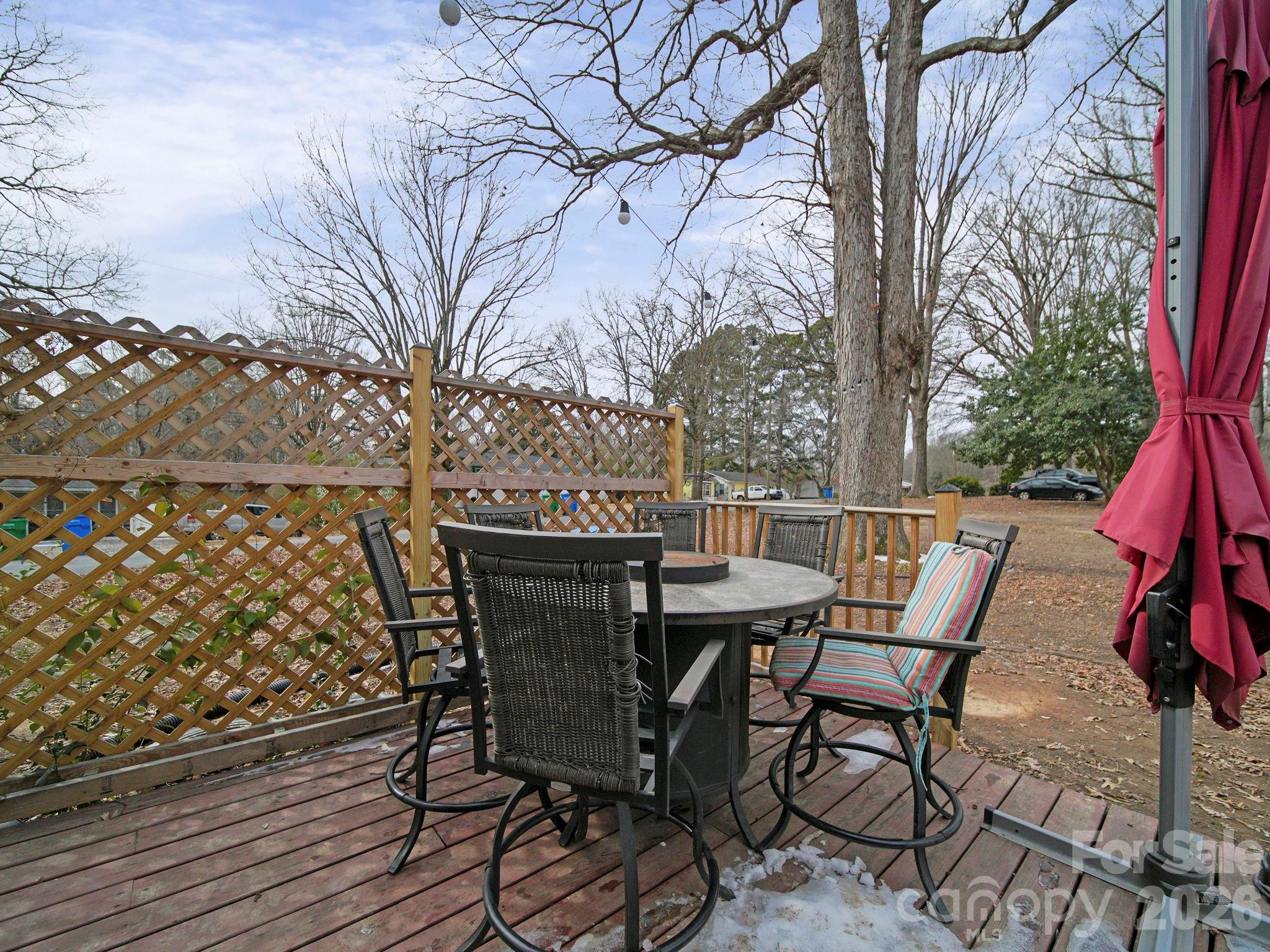 201 North Beverly Drive Locust, NC 28097 - Photo 10 of 36 a view of a chairs and table on the deck