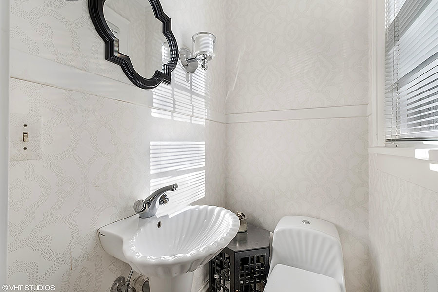 480 Sheridan Road Winnetka, IL 60093 - Photo 23 of 29 a bathroom with a sink a toilet and a mirror