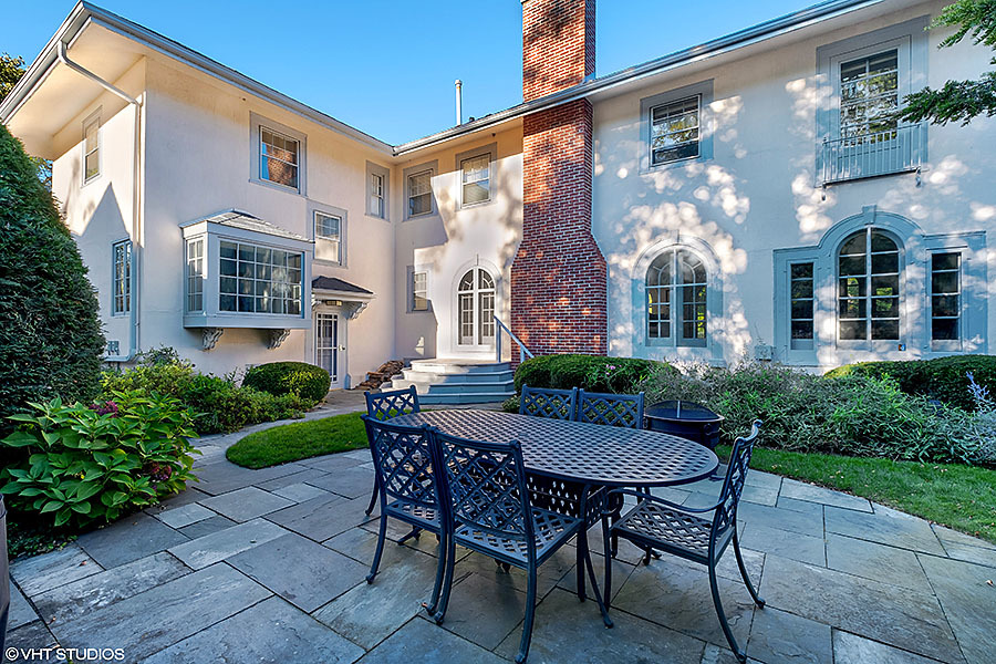 480 Sheridan Road Winnetka, IL 60093 - Photo 24 of 29 a view of a patio with a table and chairs and potted plants