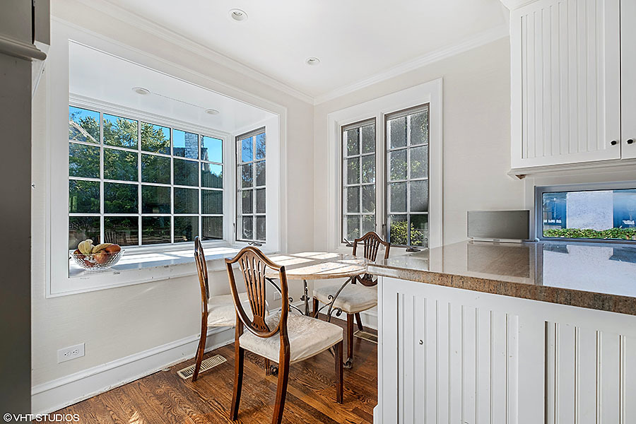 480 Sheridan Road Winnetka, IL 60093 - Photo 9 of 29 a view of a kitchen with a table and chairs