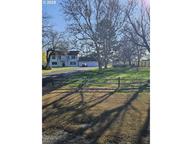 a view of a yard and front view of a building