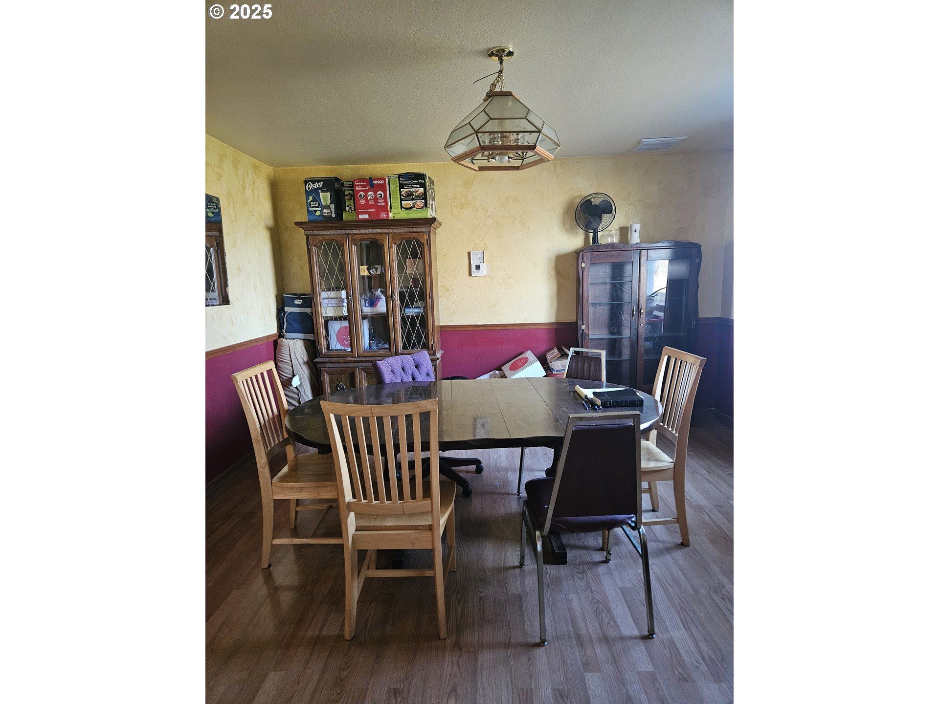 78845 Eastregaard Road Boardman, OR 97818 - Photo 6 of 27 a view of a dining room with furniture and wooden floor