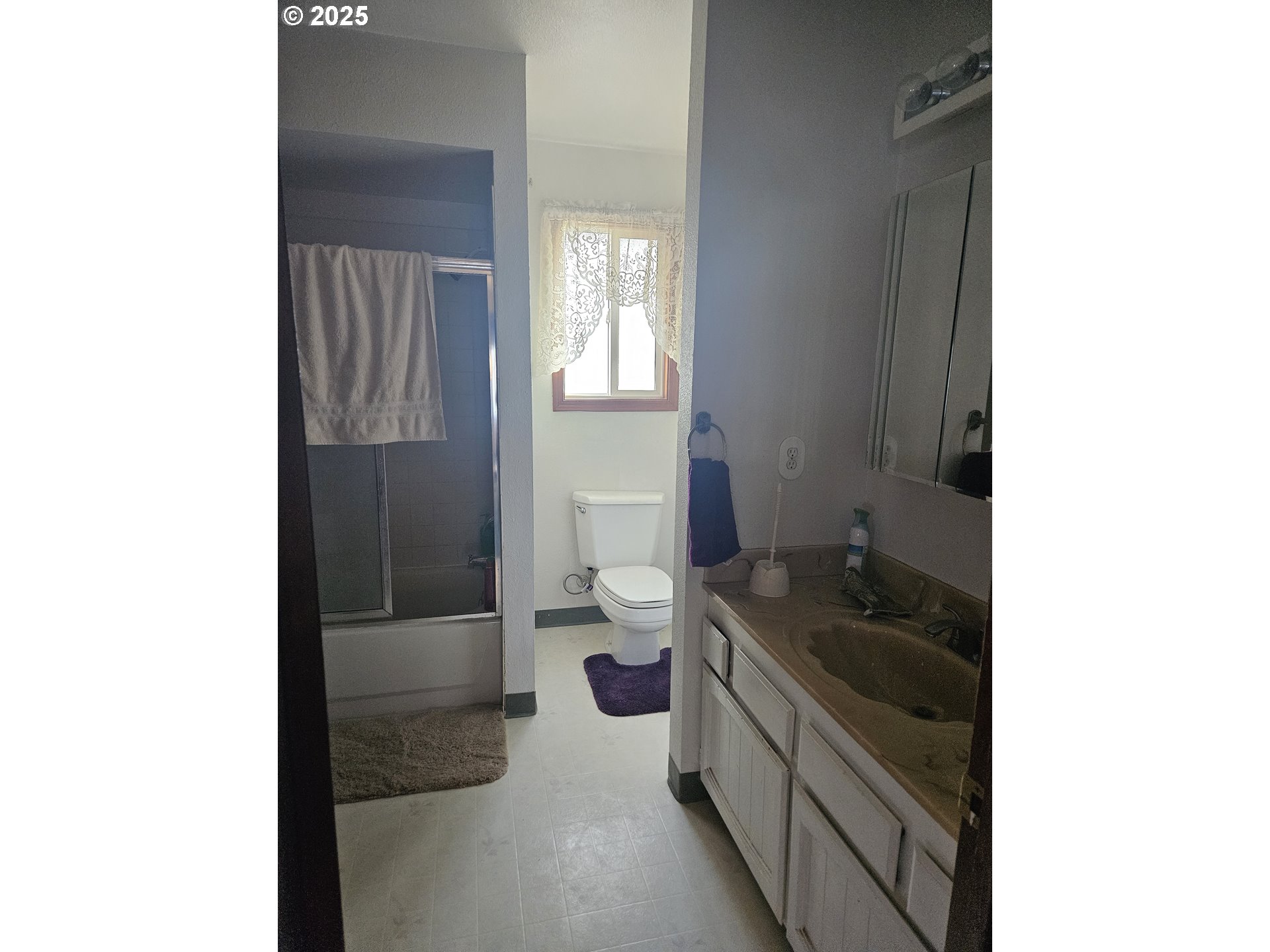 78845 Eastregaard Road Boardman, OR 97818 - Photo 10 of 27 a bathroom with a granite countertop sink and a toilet