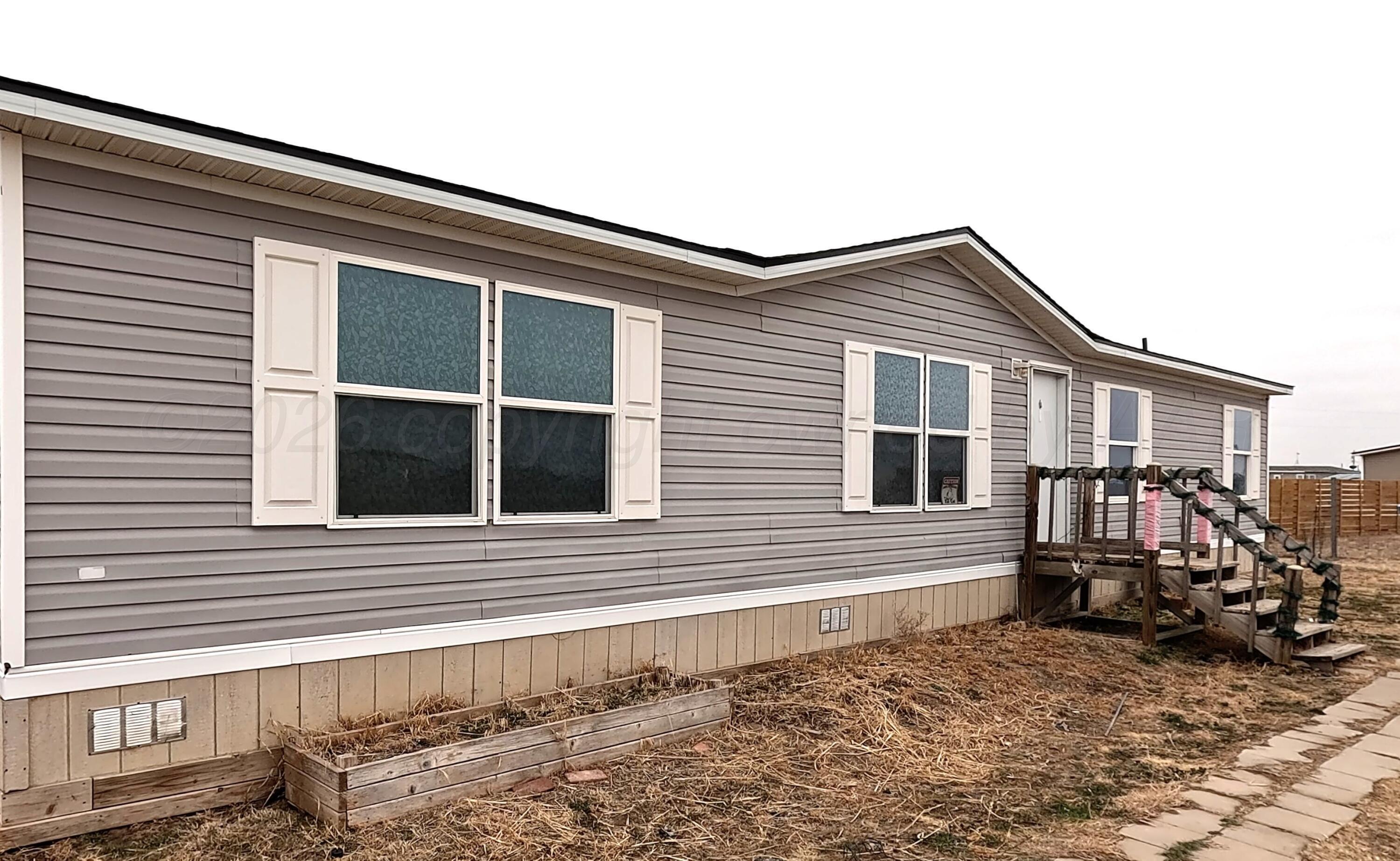 103 Bear Lane Dumas, TX 79029 - Photo 2 of 16 front of residence 1