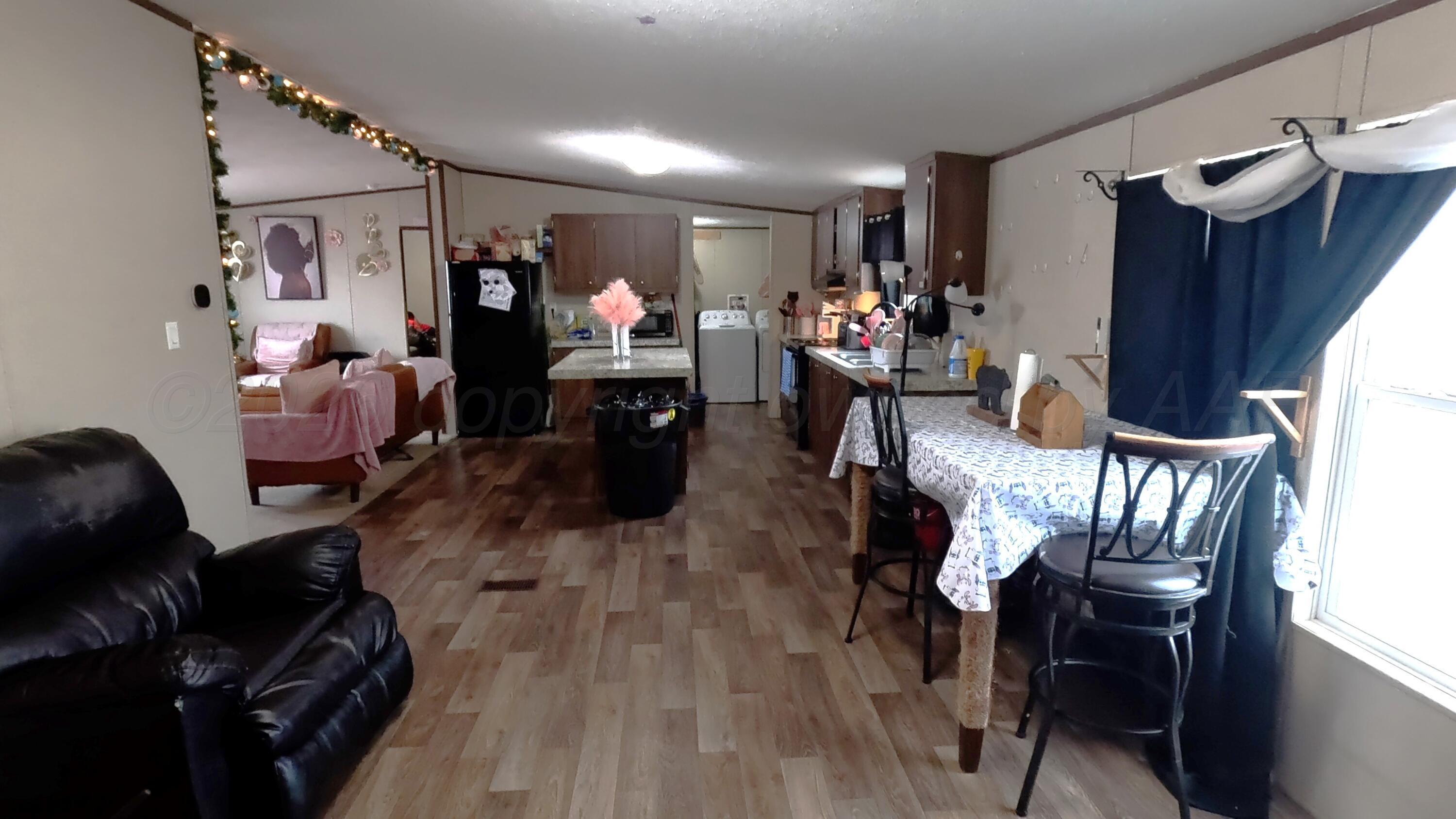 103 Bear Lane Dumas, TX 79029 - Photo 8 of 16 dining room and kitchen